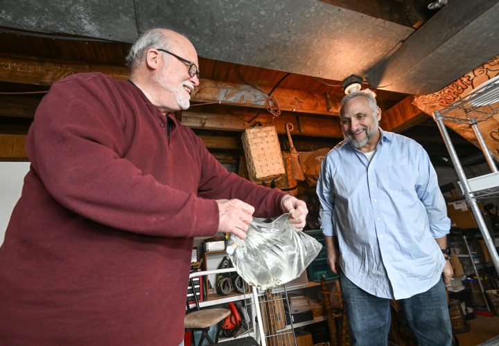 Baby fish being blessed by Merrill and Webb