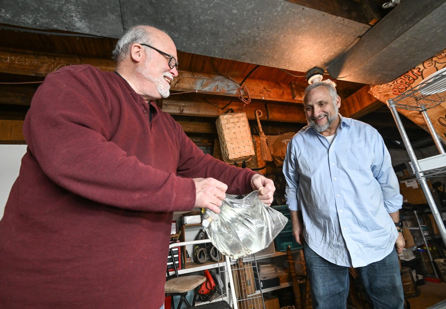 Baby fish being blessed by Merrill and Webb