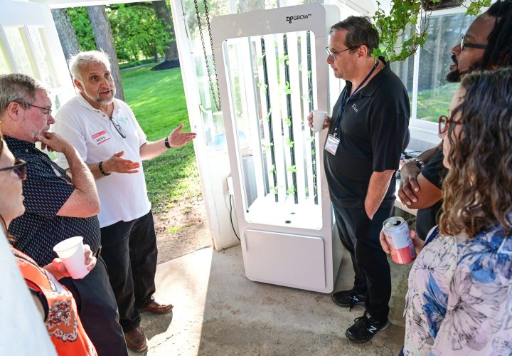 Webb in greenhouse explaining ZipGarden